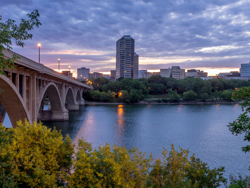 Saskatoon skyline at night along the Saskatchewan River