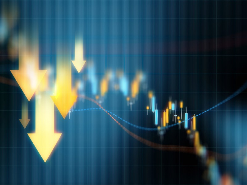 Yellow down arrows over a financial graph