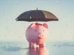 Piggybank under an umbrella