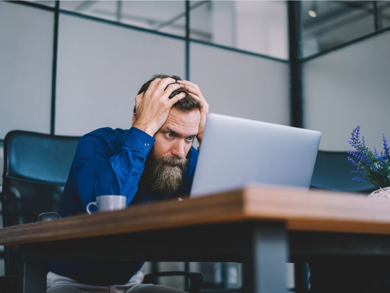 Businessman concetrating while working on laptop