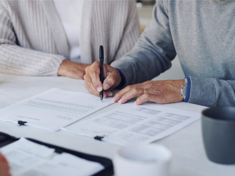 Couple signing a contract